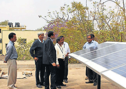 Representatives from Philips Company inspect solar lamps at Malnad Engineering College, in Hassan. DH PHOTO