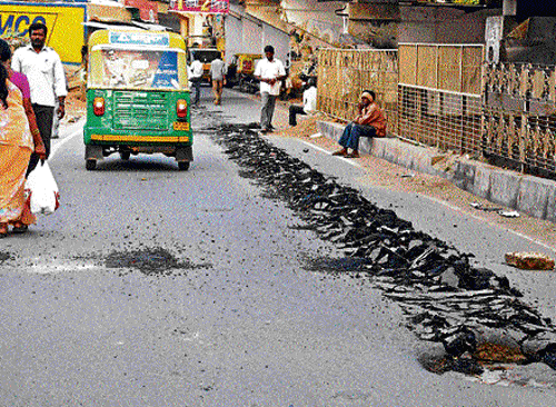 unnecessary: Newly-tarred roads are being dug up frequently. DH Photos by SK Dinesh