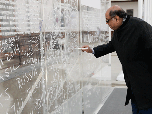 Newly elected Indian Olympic Association President, Narayna Ramachandran signs the Olympic truce wall during a welcome ceremony for the Indian Olympic team at the Mountain Olympic Village during the 2014 Winter Olympics, Sunday, Feb. 16, 2014, in Krasnaya Polyana, Russia. The Indian Olympic Association (IOA) could not have started the New Year on a happier note after a turbulent 2013. It now has newly elected office-bearers, headed by N. Ramachandran, ending a 14-month ban. AP