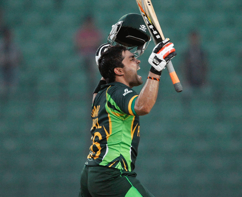 Original Pakistan's Akmal celebrates after scoring a century against Afghanistan during their Asia Cup 2014 ODI cricket match in Fatullah