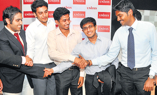 Unisys Cloud 20/20 version 5.0 Technical project contest winners congratulate each other in Bangalore on Thursday. DH Photo