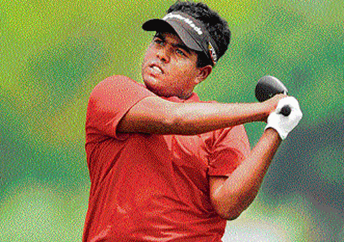on a roll: Sri Lanka's Mithun Perera watches his shot during the third round of the SAIL-SBI Open on Friday.