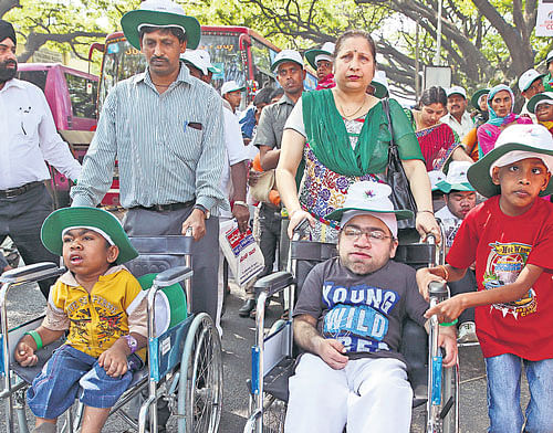 Children suffering from rare genetic disorders, take part in a silent march, in the City on Friday. Dh photo