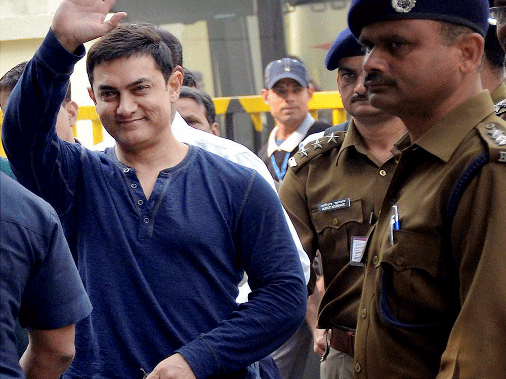 Bollywood actor Aamir Khan arrives at the airport in Patna on Tuesday to promote his TV show 'Satyamev Jayate'. PTI File  Photo