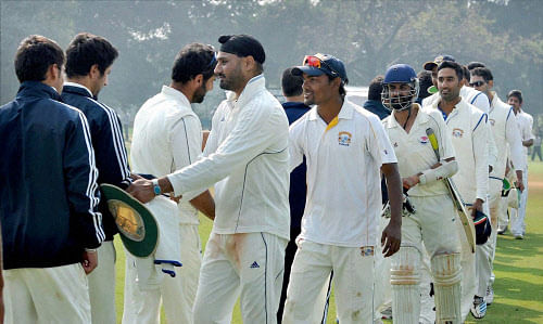 File photo of Harbhajan Singh greeting J&K players in the Ranji Trophy quarterfinal match.PTI
