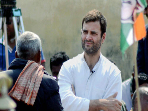 Rahul Gandhi at an interaction with rickshaw pullers to seek their opinion on party manifesto for Lok Sabha elections 2014, at Varanasi Cantt Station on Saturday. PTI Photo