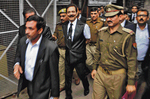 why me worry? Sahara Group Chairman Subrata Roy (centre) escorted by the police to a court in Lucknow last week after the Supreme Court ordered his arrest for failing to appear at a hearing in a long-running dispute with market regulator Securities and Exchange Board of India. Reuters