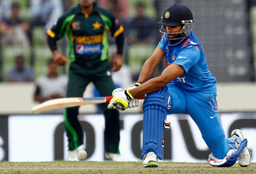 India's Ravindra Jadeja plays a shot during the Asia Cup one-day international cricket tournament against Pakistan in Dhaka, Bangladesh, Sunday, March 2, 2014. (AP Photo/A.M. Ahad)