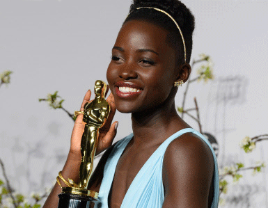 Lupita Nyong'o poses in the press room with the award for best actress in a supporting role for '12 Years a Slave' during the Oscars at the Dolby Theatre on Sunday, March 2, 2014, in Los Angeles. AP photo