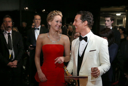 Jennifer Lawrence, left, and Matthew McConaughey appear backstage during the Oscars at the Dolby Theatre on Sunday, March 2, 2014, in Los Angeles. (AP Photo)