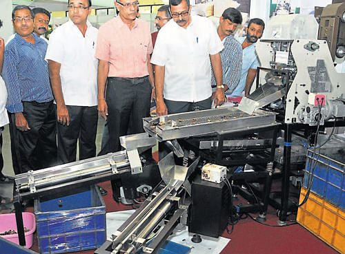 Deepa Packers Proprietor Surendra Prabhu, District Small Industries Association President N Arun Padiyar, Department of Medium, Small and Micro Industries Deputy Director Socrates and others at an industrial machinery exhibition at Hotel Woodlands in Mangalore on Sunday. DH Photo