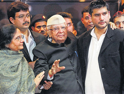 Veteran Congress politician N D Tiwari with Rohit Shekhar after accepting him as his son, at a press conference in NewDelhi on Monday. PTI