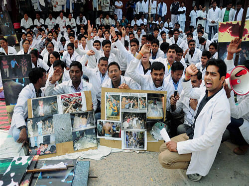 Junior doctors shout slogans during the 5th day of their strike in Allahabad on Wednesday in protest against alleged police atrocity on their counterparts in Kanpur. PTI