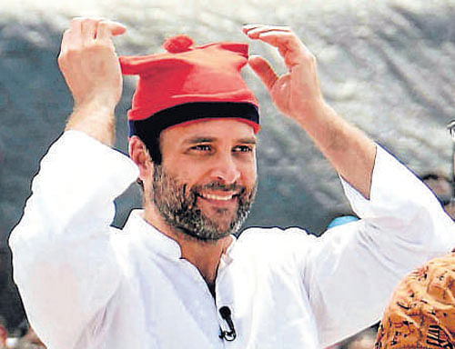 Congress vice-president Rahul Gandhi wears a cap as he interacts with fishermen in Mumbai on Thursday. PTI