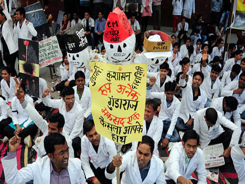 Junior doctors shout slogans during the sixth day of their strike in Allahabad on Thursday. PTI