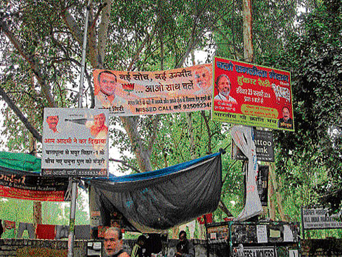 Posters such as these of BJP leaders and others from rival parties, who are vying for tickets to fight the Lok Sabha polls, have come up across the city. DH photo/ Abhishek anand