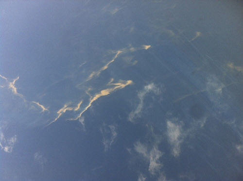 An aerial view of an oil spill is seen from a Vietnamese Air Force aircraft in the search area for a missing Malaysia Airlines plane. Reuters.