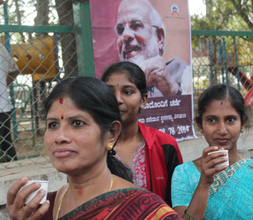 Women having tea at the event 'Chai pe Charcha ' with Narendra Modi on Women empowerment at J P Nagar 3rd phase in Bangalore on Saturday.Dh Photo