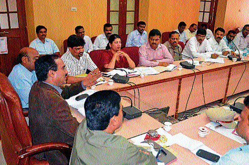 Deputy Commissioner B S Shekharappa, ZP CEO P B Karunakar and other officials take part in a preparatory meeting for election at the deputy commissioner's hall in Chikmagalur on Saturday. dh photo