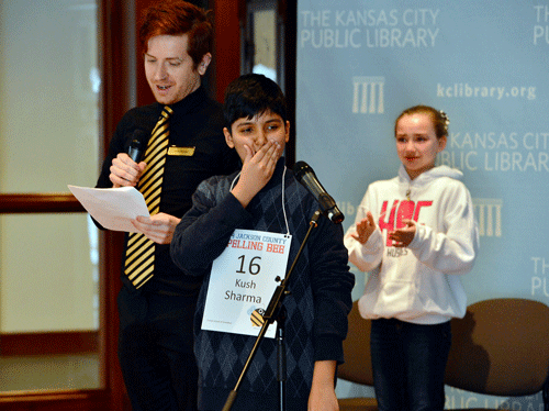 Kush Sharma, center, reacts after spelling 'definition' to win the Jackson County Spelling Bee in the 29th round at the Central Library, as Sophia Hoffman, right, looks on, in Kansas City, Mo., Saturday, March 8, 2014. Two weeks ago, the bee ran out of words after the two eliminated 23 other contestants and went another 47 rounds against each other. (AP Photo)