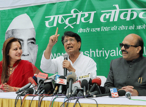 RLD chief Ajit Singh addressing the media after MPs Jaya Prada and Amar Singh join his party in New Delhi on Monday. PTI Photo