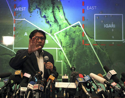 Malaysia's Department of Civil Aviation's Director General Azharuddin Abdul Rahman briefs reporters on search and recovery efforts within existing and new areas for missing Malaysia Airlines plane during a press conference, Monday, March 10, 2014 in Sepang, Malaysia. The search operation for the missing Malaysia Airlines MH370 which has involved 34 aircraft and 40 ships from several countries covering a 50-nautical mile radius from the point the plane vanished from radar screens between Malaysia and Vietnam continues after its disappearance since Saturday. Experts say possible causes of the apparent crash include an explosion, catastrophic engine failure, terrorist attack, extreme turbulence, or pilot error or even suicide. AP photo