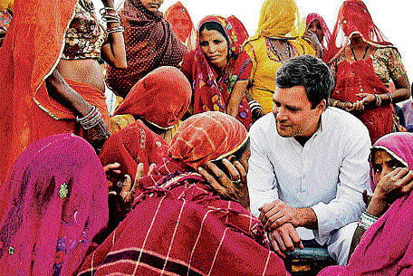 Congress vice-president Rahul Gandhi interacts with a group of women mine workers at Kolayat, on Monday. PTI