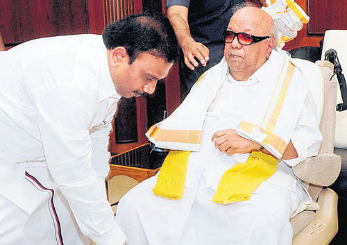 Former Union minister A Raja seeks blessing of DMK chief M Karunanidhi in Chennai on Monday. PTI