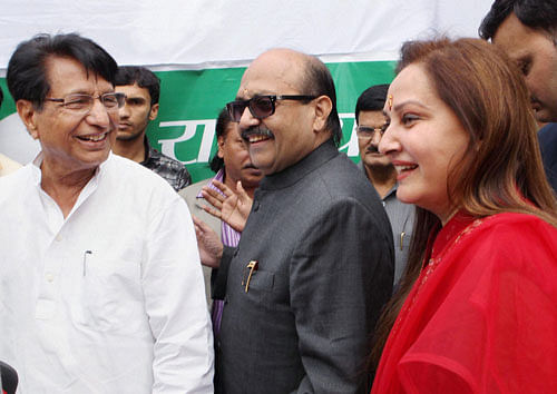 RLD chief Ajit Singh with MPs Jaya Prada and Amar Singh after they joined his party in New Delhi on Monday. A day after they joined RLD, Amar Singh and Rampur MP Jaya Prada were today named party candidates from Fatehpur Sikri and Bijnore Lok Sabha seats respectively. PTi File Photo