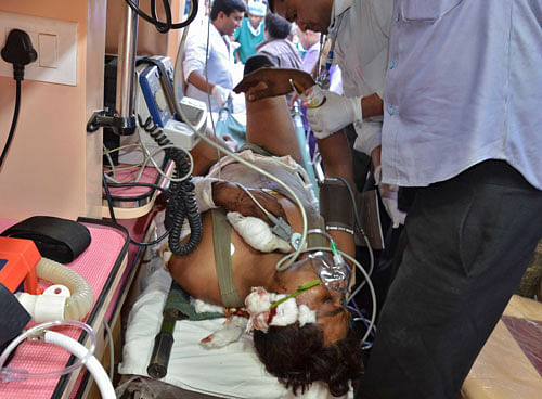 An injured CRPF personnel is taken to a hospital at Raipur Chhattisgarh March 11, 2014. Maoist rebels ambushed police and killed 16 involved in a mine clearing operation on Tuesday, police said, as the insurgents demonstrated their strength ahead of a general election next month. REUTERS