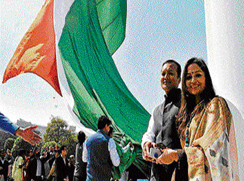 crusaders Naveen and Shallu Jindal unfurl the largest  national flag in the City. DHNS
