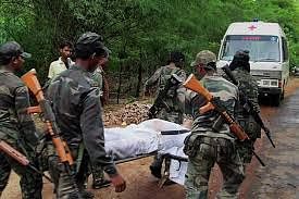 File photo of security personnel carrying a body at the site of Naxals ambush in Bastar. PTI Photo
