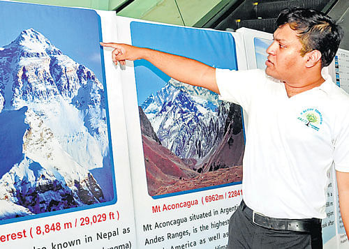 Mountaineer Satyarup Siddhanta shows the mountains he climbed, at a press conference in the City recently.