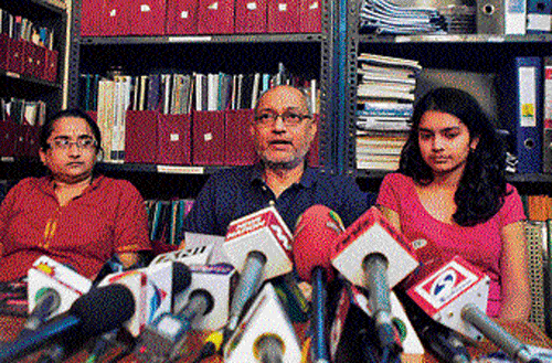 Narendran, husband of Chandrika Sharma, speaks to the media with their daughter Meghna( right) in Chennai on Wednesday. AP