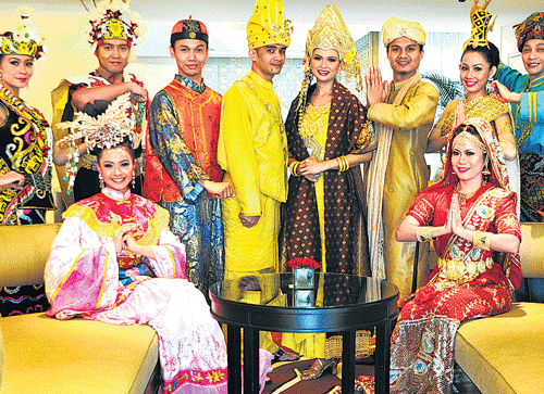 Malaysian artistes dressed up in ethnic costumes at a press conference in Bangalore on Friday. dh photo