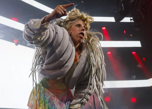 Lady Gaga makes an appearance during ZEDD's, not pictured, performance at the iTunes Festival Showcase during the SXSW Music Festival Friday March 14, 2014, in Austin, Texas. (Photo by Jack Plunkett/Invision/AP)