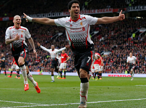 Liverpool's Luis Suarez celebrates his goal against Manchester United during their English Premier League soccer match at Old Trafford in Manchester, Reuters