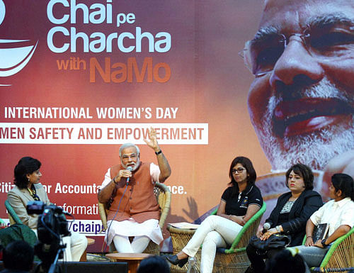 BJP prime ministerial candidate Narendra Modi interacts with women from various parts of the country during the second round of 'Chai Pe Charcha with NaMo' programme in New Delhi on Women's Day on Saturday. PTI File Photo