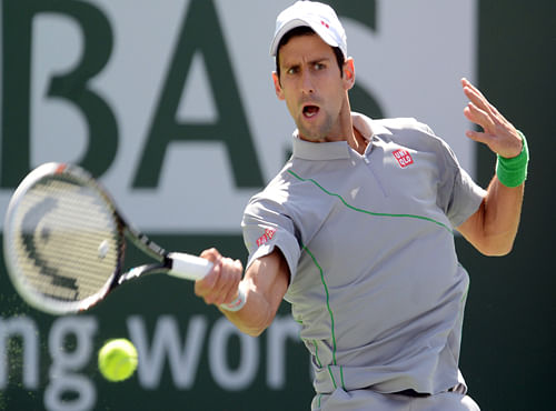 Novak Djokovic (SRB) during his semifinal match against John Isner (USA) at the BNP Paribas Open at Indian Wells Tennis Garden. Djokovic won 7-5, 6-7, 6-1, Reuters