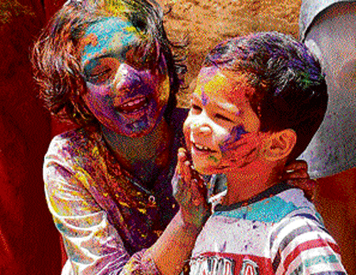 hues of joy: It was a riot of colours for the young and the old alike in the City, who are junking artificial colours for the harmless natural variety this year. dh photos