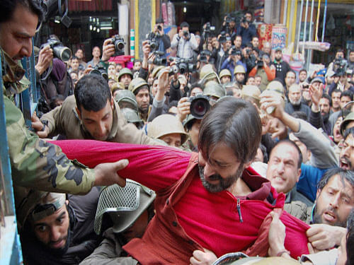 Police detain JKLF Chairman Mohd Yasin Malik along with his supporters during a protest in Srinagar. PTI Photo