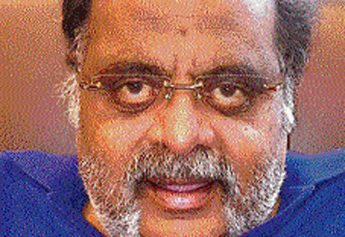 A video grab of Housing Minister M H Ambarish addressing media from a hospital in Singapore on Tuesday.