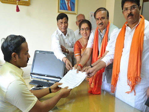 BJP leader Ananth Kumar, Union Minister K H Muniyappa and JDS state President A Krishnappa filed their nominations, as the process for the April 17 Lok Sabha polls in Karnataka was set in motion today. DH Photo