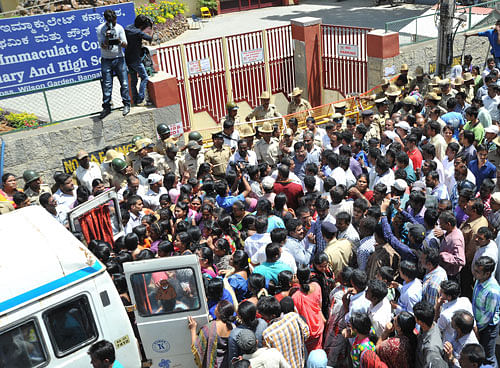 Situation became tense at Mary Immaculate High School soon after victims' relatives wanted to take the bodies of Priyanka and Sonal, who committed suicide at Sankey Tank on Tuesday afternoon, inside the school campus. DH Photo by Srikantha Sharma R