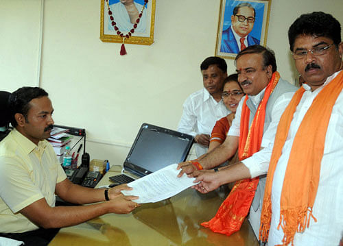 Bharatiya Janata Party leader & Bangalore South constituency candidate Ananth Kumar with his wife filing his nomination papers in Bengaluru on Wednesday. PTI Photo