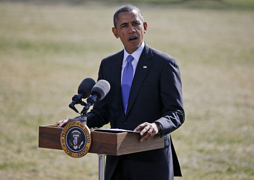 President Barack Obama makes a statement on Ukraine, Thursday, March 20, 2014, on the South Lawn at the White House in Washington before departing for Florida. President Barack Obama said the US is levying a new round of economic sanctions on individuals in Russia, both inside and outside the government, in retaliation for the Kremlin's actions in Ukraine. He also said he has also signed a new executive order that would allow the U.S. to sanction key sectors of the Russian economy. AP Photo