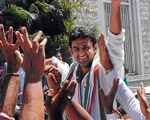 Karnataka Youth Congress president and party's candidate for Bangalore Central, Rizwan Arshad, is cheered by workers after he submitted his nomination papers in Bangalore on Thursday. dh photo