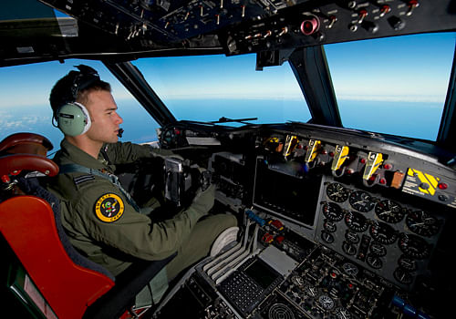 Southern Indian Ocean during the search for missing Malaysian Airlines flight MH370 Royal Australian Air Force (RAAF) pilot, Flight Lieutenant Russell Adams from 10 Squadron, steers his AP-3C Orion over the Southern Indian Ocean during the search for missing Malaysian Airlines flight MH370 in this picture released by the Australian Defence Force March 20, 2014. Aircraft and ships ploughed through bad weather on Thursday in search of floating objects in remote seas off Australia that Malaysia's government called a 'credible lead' in the trans-continental hunt for a jetliner missing for 12 days. REUTERS