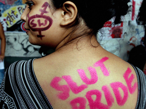 Swathed in trendy dhotis, sporting bright red devil's horns, around 200 people spanning diverse ethnic and gender communities took to the streets in the third edition of the Kolkata slutwalk Friday advocating 'being human'. PTI File Photo
