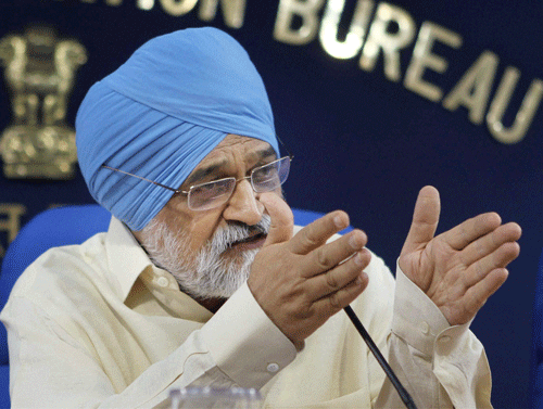 Coming to the defence of former Sebi chief C B Bhave and its former member K M Abraham, Planning Commission Deputy Chairman Montek Singh Ahluwalia on Saturday said that they are officers of "terrific integrity" and CBI has not charged them with anything, PTI photo